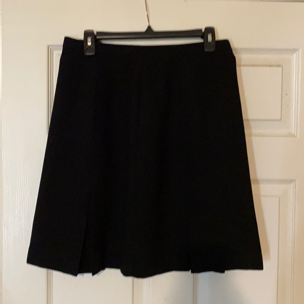 Black business casual skirt with pleats.